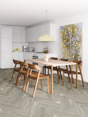 A kitchen with dark hardwood flooring.