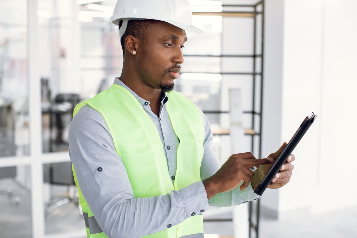 Construction worker using tablet