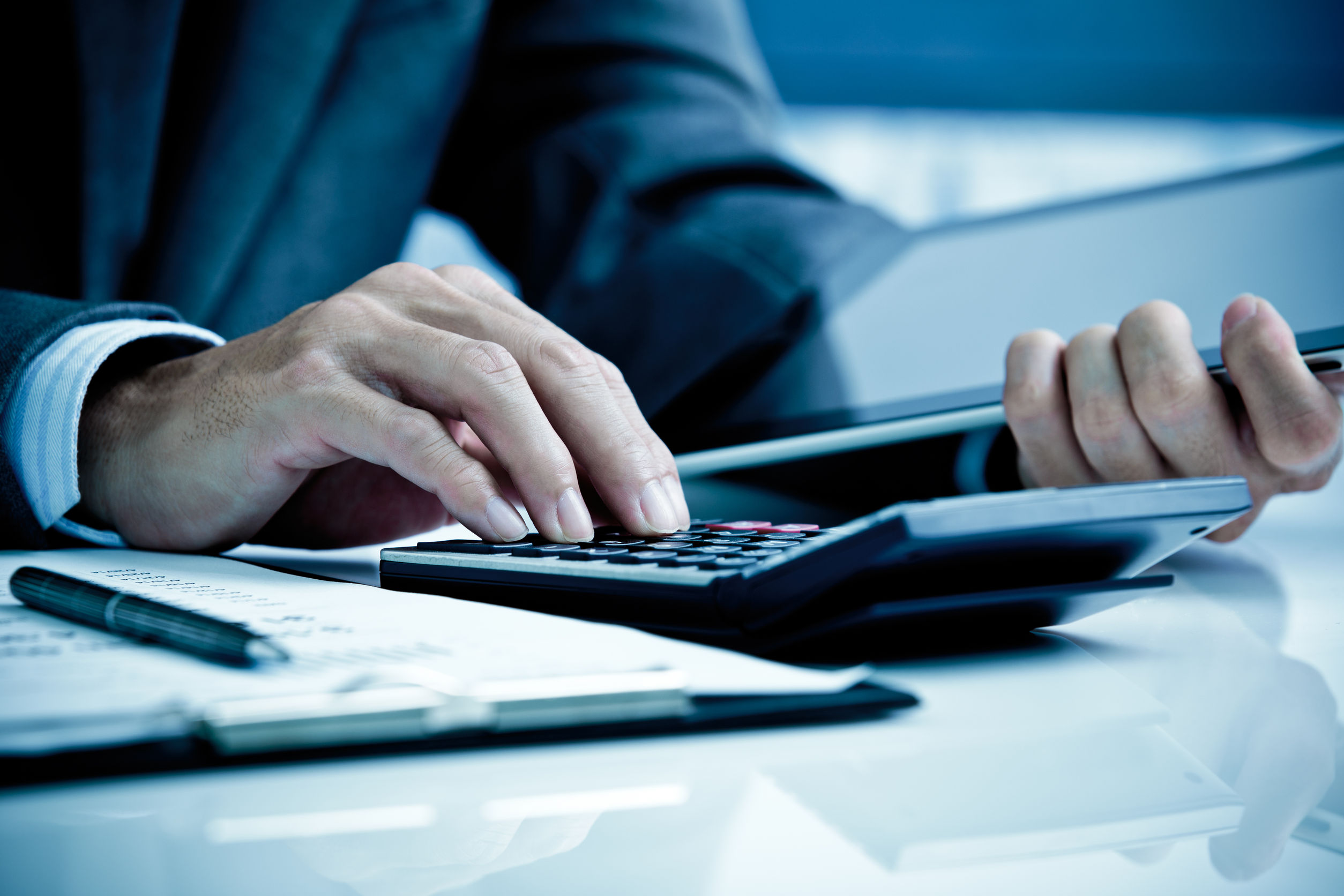 A person working on a calcualtor