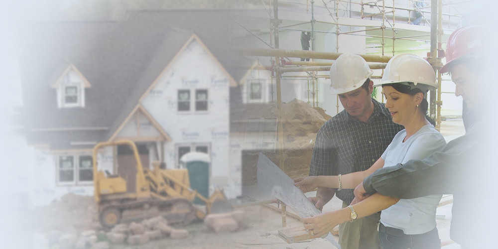 Builders wearing white hard hats in front of a house